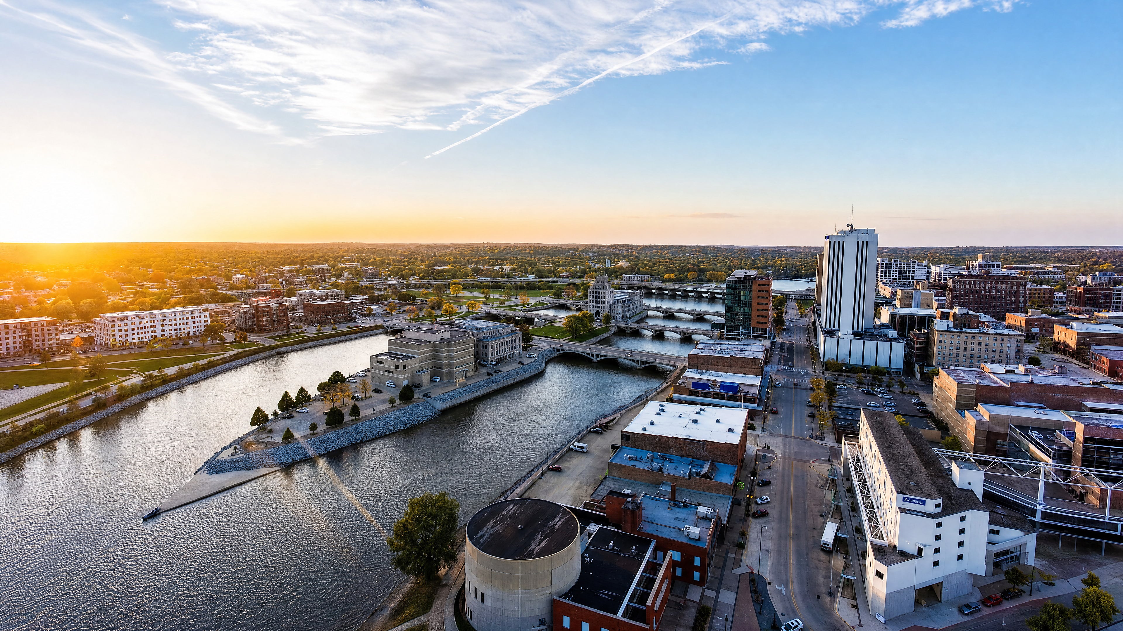 Aerial view of downtown Cedar Rapids at sunset along the Cedar River